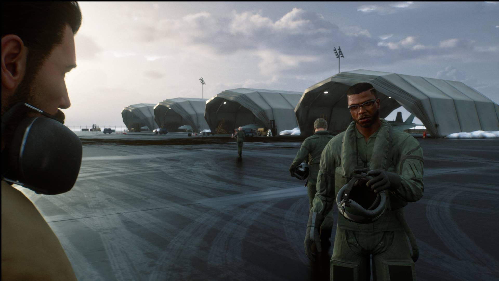 Ace Combat 8 flight crew beside aircraft hangars
